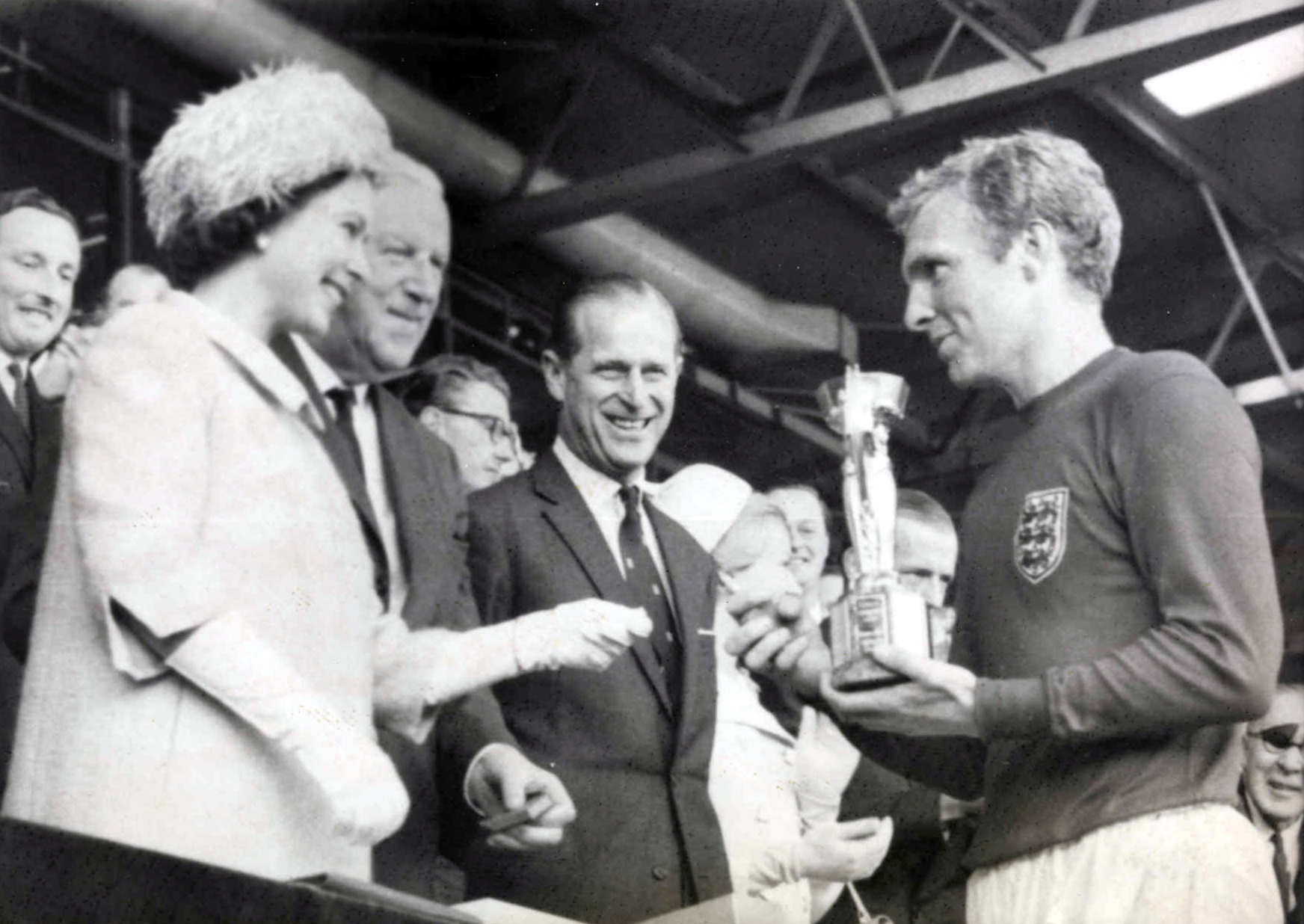 The Queen presents Bobby Moore with the World Cup